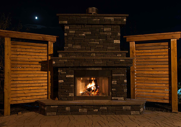 Outdoor fireplace in Sage Hill, Calgary landscape design