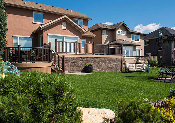 Tuscany, Calgary back yard landscape design with mulitlevel deck construction.